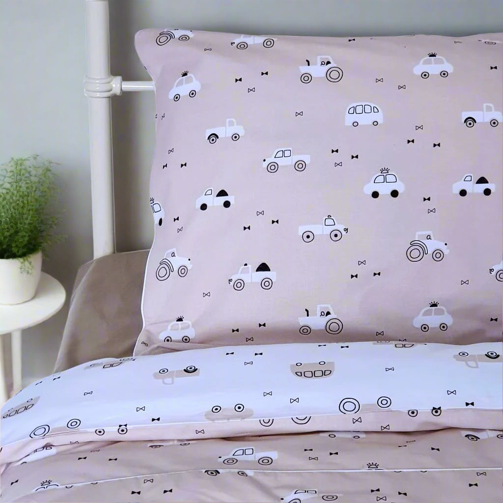 Single bed styled with beige duvet cover and pillowcase featuring a neutral-toned cars and tractors design, perfect for a boy’s bedroom