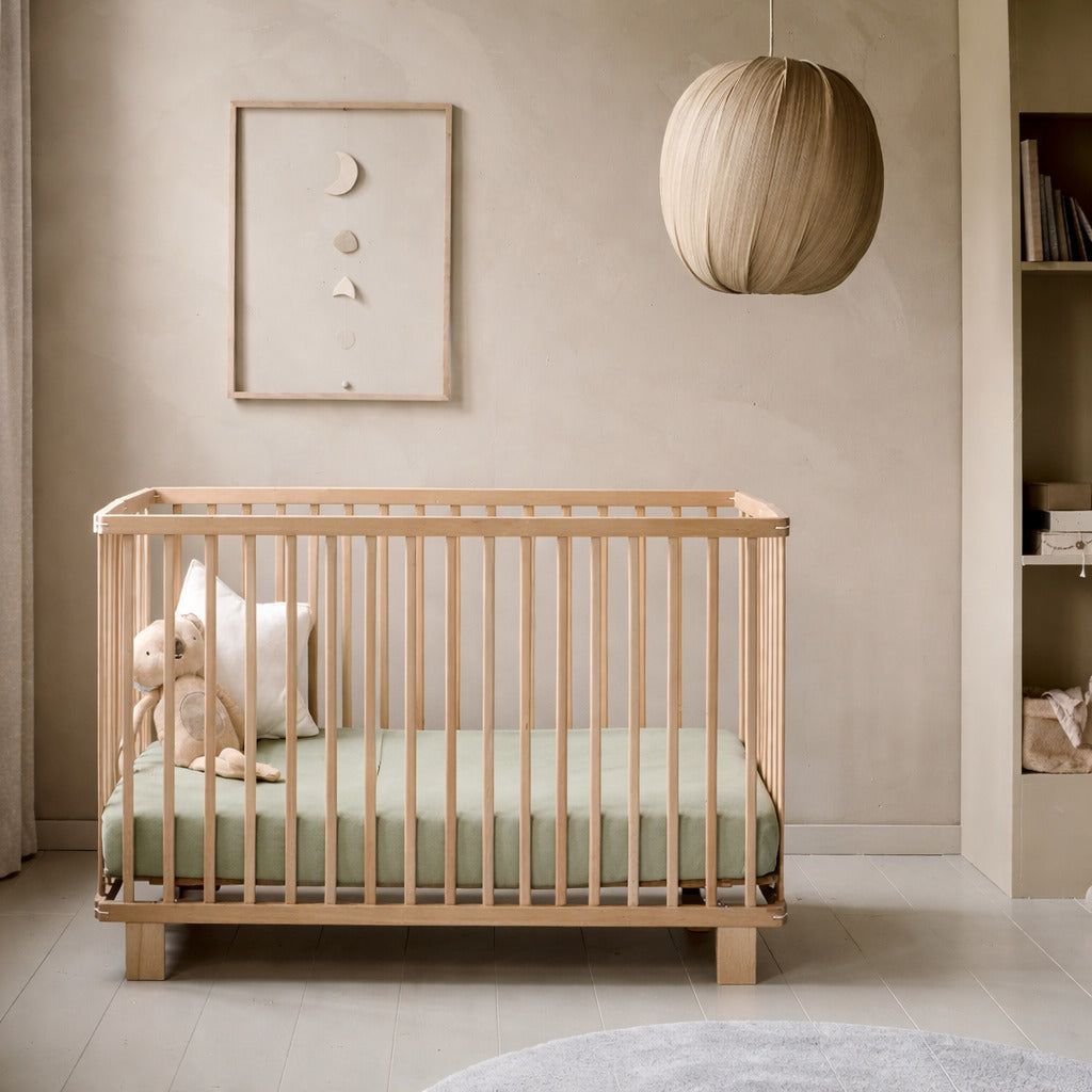 Soft green crib sheet in nursery , baby cot in green uk