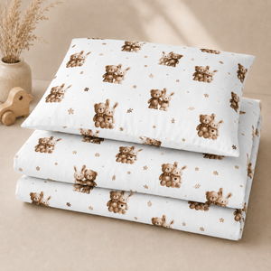 Teddy bear and bunny cot bedding set in beige and brown on white cotton styled in a natural wood Scandinavian nursery
