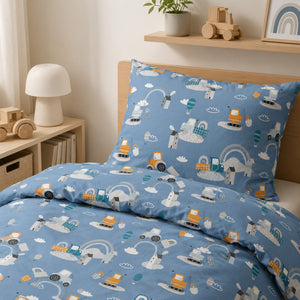 Kids’ blue single bedding set with tractors, diggers, hot air balloons and rainbows on a standard UK single bed.