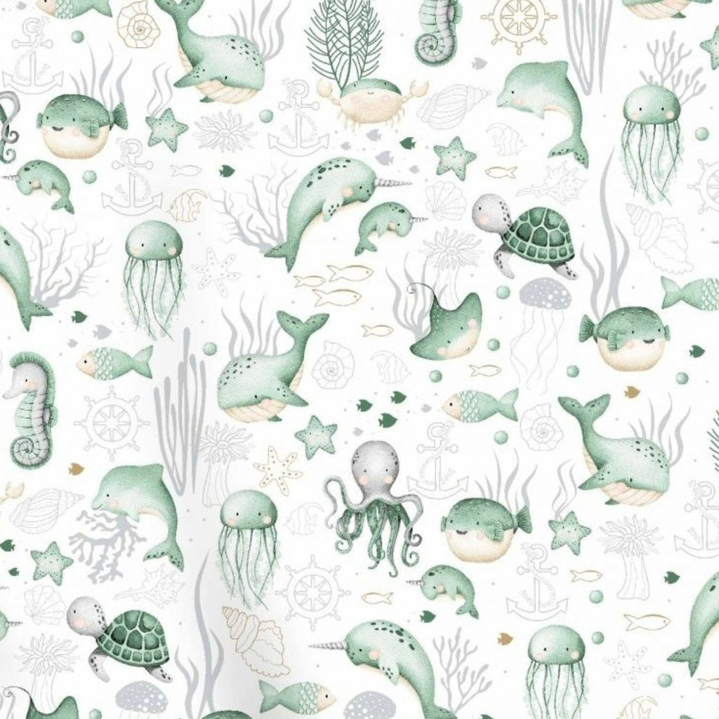 Under the Sea mint green cotton fabric by the metre from Fabricco UK with whales, turtles, octopus and sea life for nursery sewing.