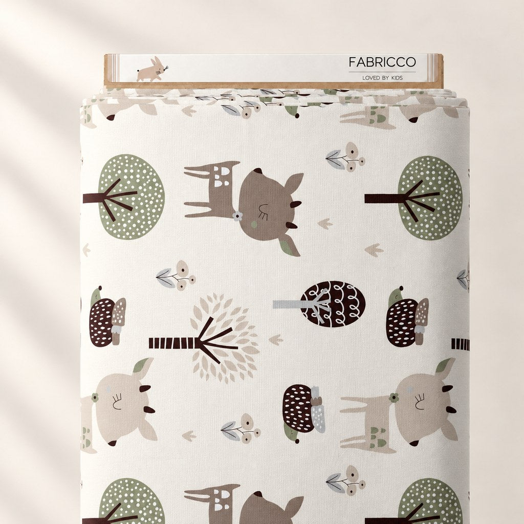 Woodland deer and hedgehog cotton fabric wrapped around a Fabricco bolt, with beige, brown and muted green details