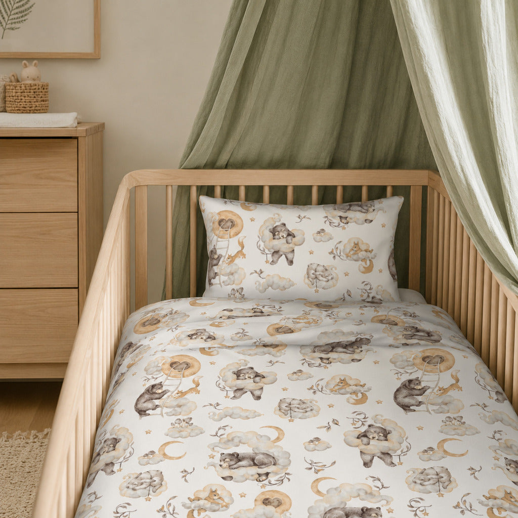 Woodland Dreams cot bedding set with matching duvet cover and pillowcase in beige, cream and soft brown woodland animal print. Fabricco