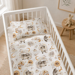 Woodland Dreams cot and cot bed bedding set with sleepy woodland animals, clouds and moons in a neutral beige nursery.
