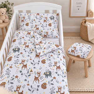 Woodland friends baby bedding set styled in a soft neutral nursery with cot and cot bed bedding