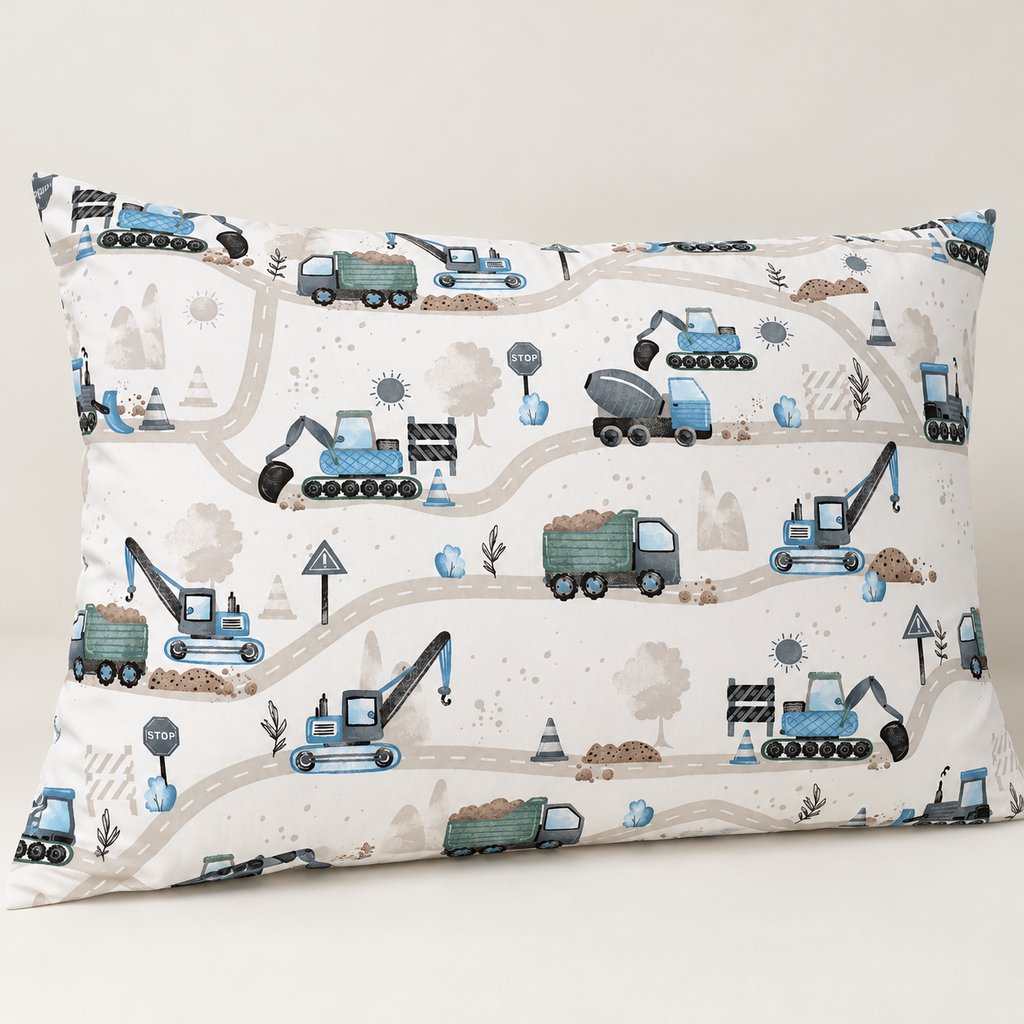 Blue digger cotton pillowcase showing excavators, cranes, green dump trucks and grey roads against a plain neutral background.