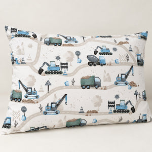 Blue digger cotton pillowcase showing excavators, cranes, green dump trucks and grey roads against a plain neutral background.