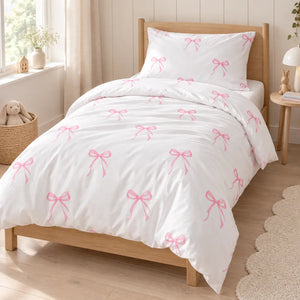 pink bow single bed bedding set for girls, handmade in the UK from soft OEKO-TEX cotton. Includes single duvet cover and pillowcase for a calm, pretty bedroom.