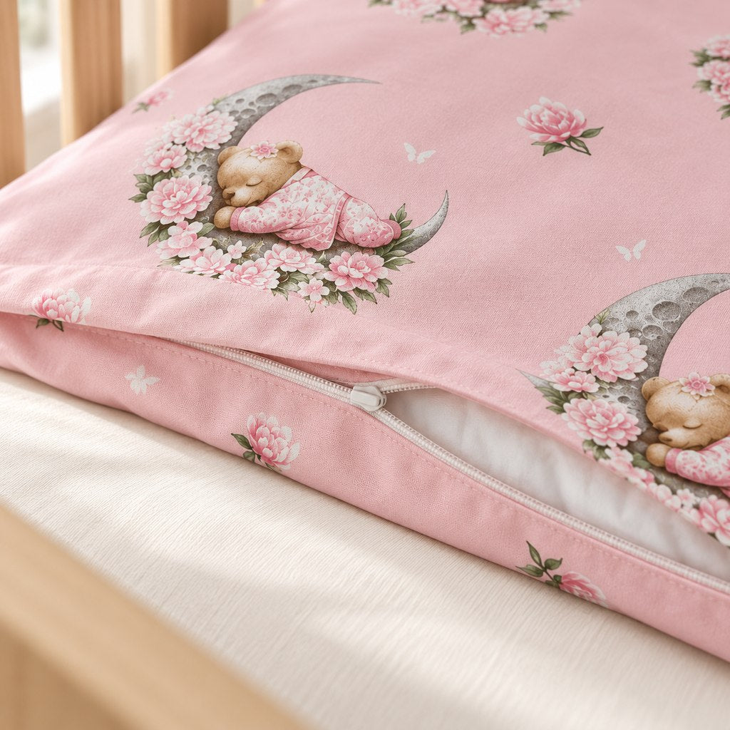 Close-up of the pink teddy bear duvet cover showing its white zip fastening without a puller.