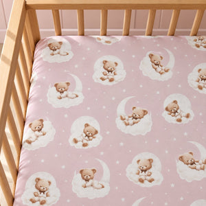 Pink teddy bear fitted sheet in a baby girl’s nursery