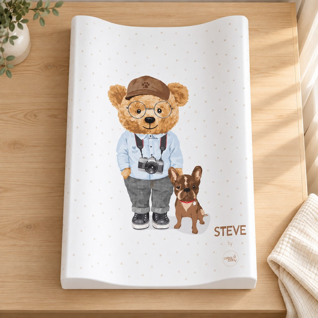 Top view of Steve baby changing mat showing a teddy bear with a camera and a small brown dog