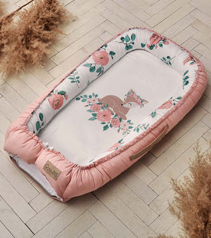 Fabricco . The Baby Nest is designed to provide newborns  a cozy place to sleep and rest, and  wraps the baby from the first days of life to create a sense of security
